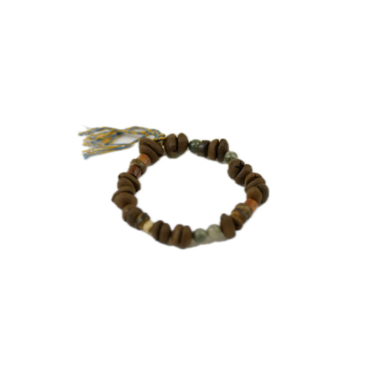 Bracelet with coffee bean and natural stone beads on a white background