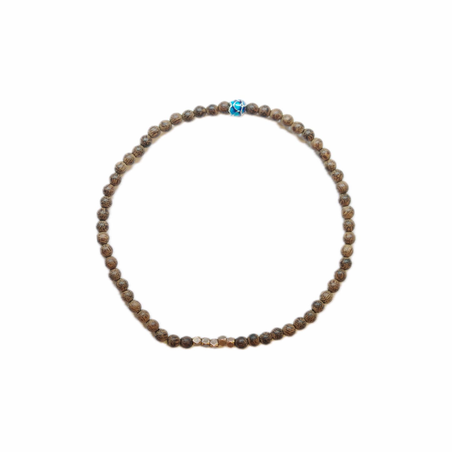 Close-up of a beaded bracelet featuring brown patterned beads, with central gold accent and a vibrant blue decorative bead.