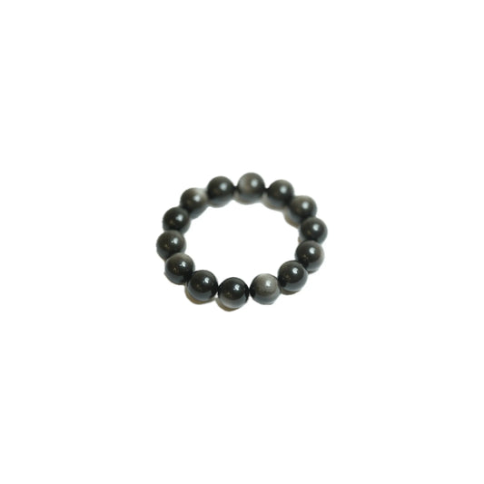 Angled product shot of the substantial 18mm Silver Sheen Obsidian crystal bracelet, highlighting the unique glossy finish and energetic presence of each genuine gemstone bead at Singoau.