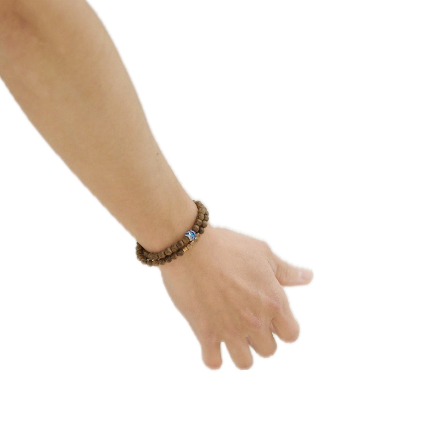 A hand wearing a wooden bead bracelet points outward, showcasing the bracelet's natural texture and a small decorative bead on a white background.