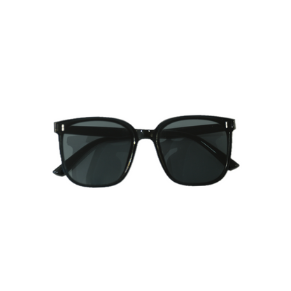 A pair of stylish black sunglasses with dark lenses, positioned symmetrically and showcasing a sleek, modern design.