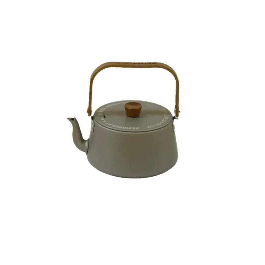 A minimalist gray kettle with a wooden lid and handle, featuring a curved spout and a sleek, modern design on a white background.