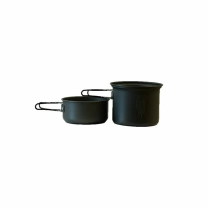 Two dark gray cooking pots with metal handles, one larger and taller than the other, positioned side by side on a white background.