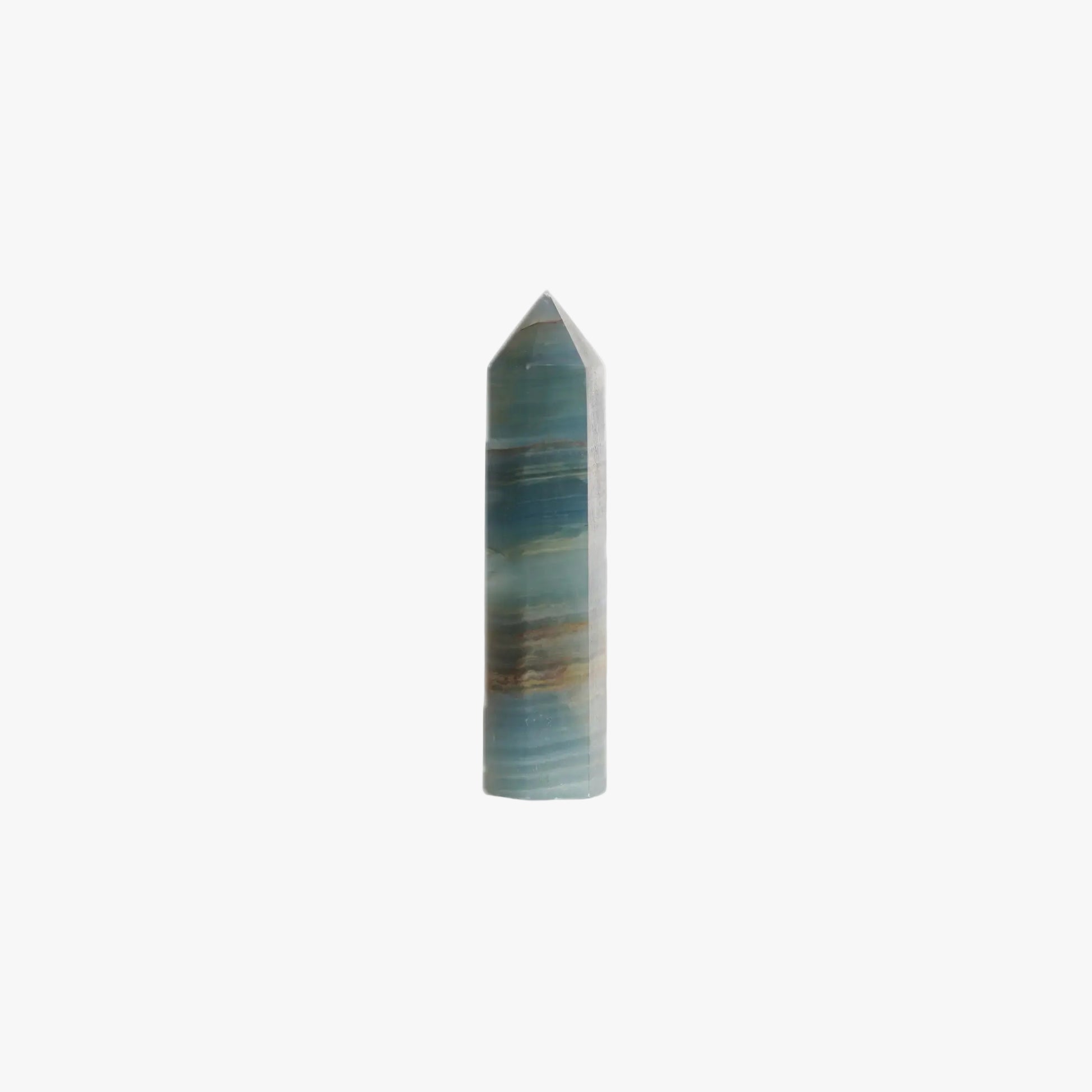 blue onyx crystal point tower on a white background