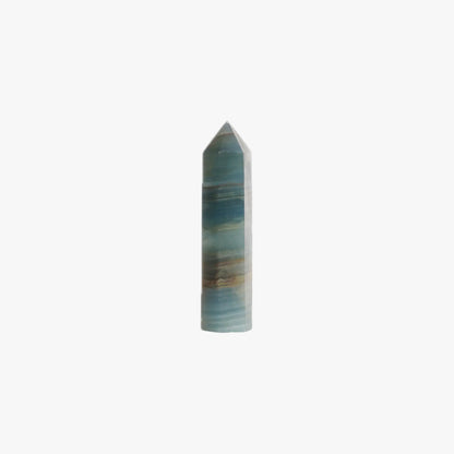 blue onyx crystal point tower on a white background