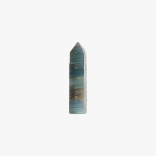 blue onyx crystal point tower on a white background