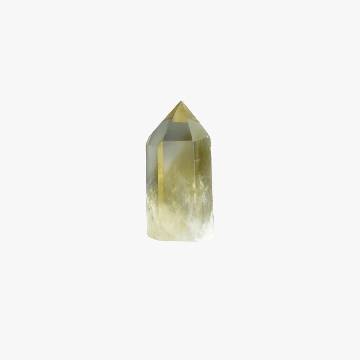 A natural pointed crystal tower, likely a quartz point, featuring a gradient from translucent pale yellow-green at the base to a clear, golden-yellow tip, set against a solid white background.