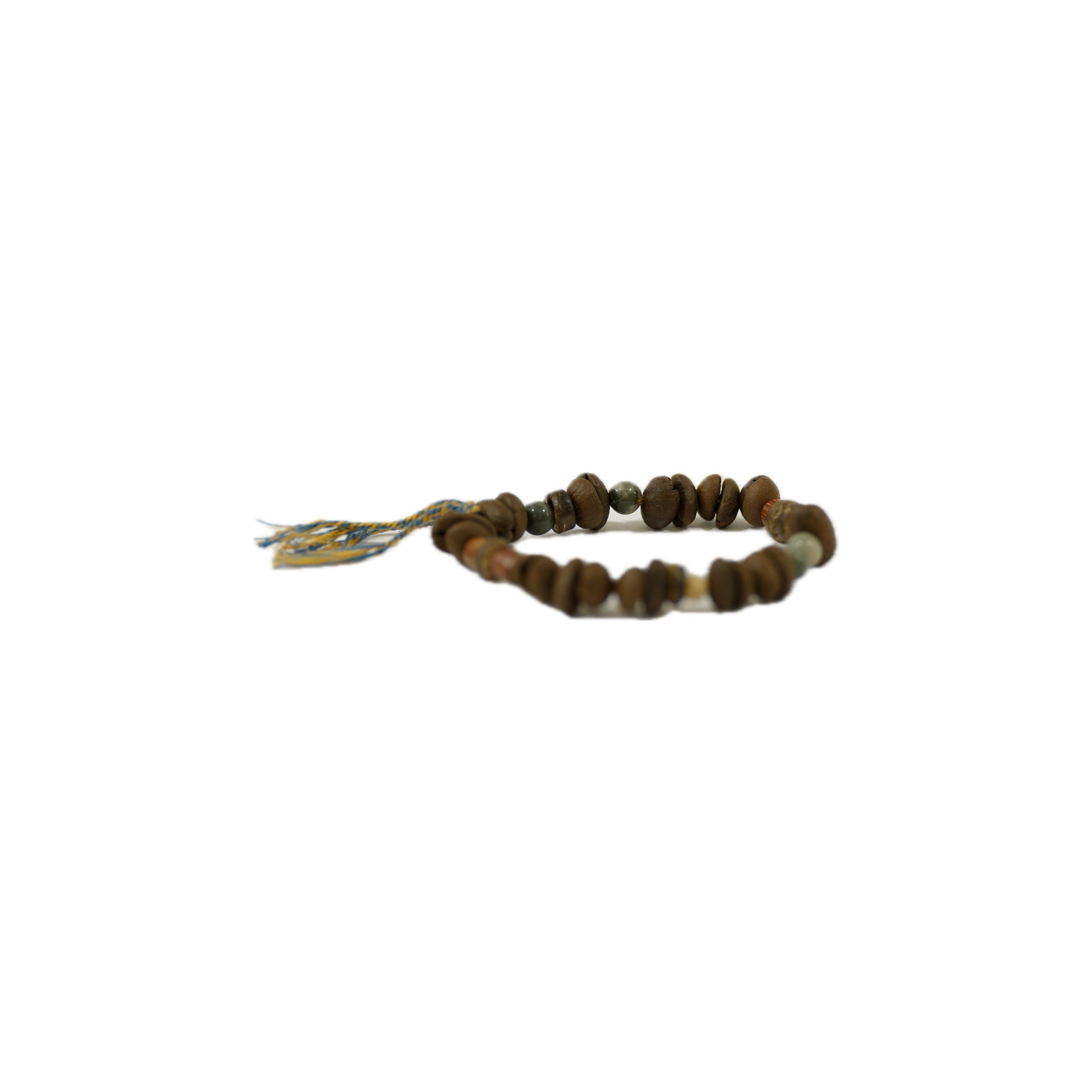 A handmade bracelet featuring Coffee bean beads in various earthy tones, with a decorative tag and colorful string.