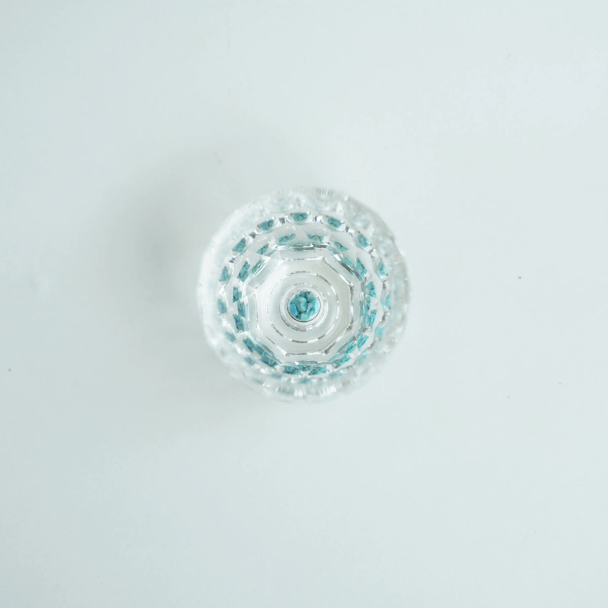 Bird view of Crystal Turquoise Faceted Cup 65ml on  grey background