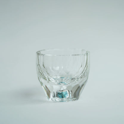 Crystal Turquoise Faceted Cup 65ml on grey background
