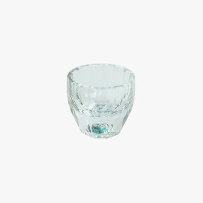 Close-up of a clear Crystal Turquoise Faceted Cup against a white background.