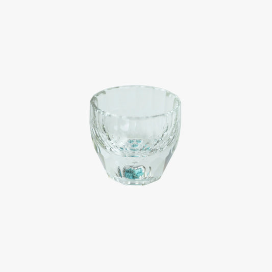 Close-up of a clear Crystal Turquoise Faceted Cup against a white background.
