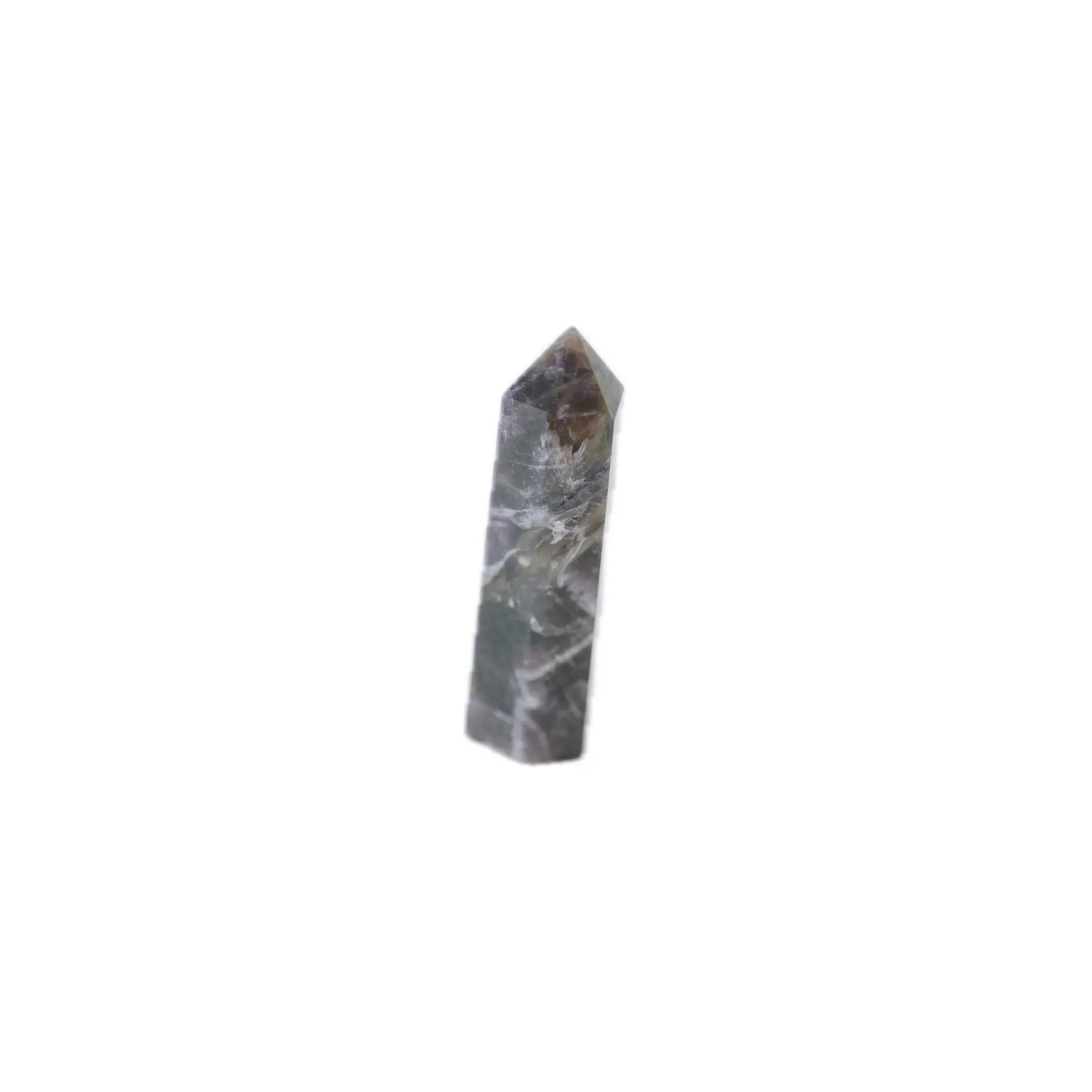 A polished natural crystal point, identified as dream amethyst tower with dark gray and white marbling, centered on a solid white background.