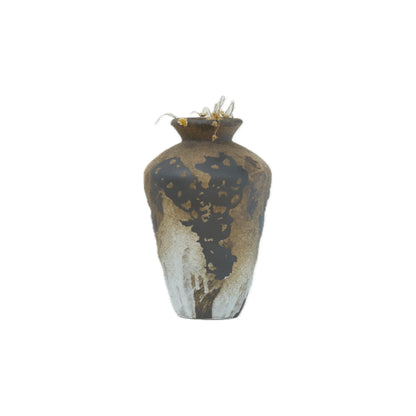 Ceramic vase with an abstract dark brown and white pattern containing dried flowers on a white background.