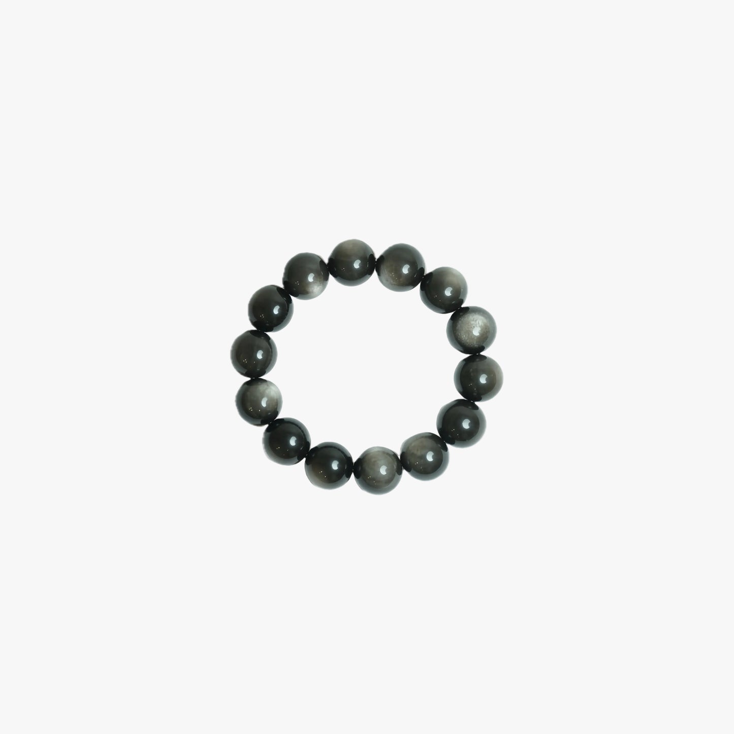 Handcrafted 18mm Silver Sheen Obsidian crystal bracelet with mesmerizing natural chatoyancy, viewed top-down on a clean white background for grounding and reflection at Singoau