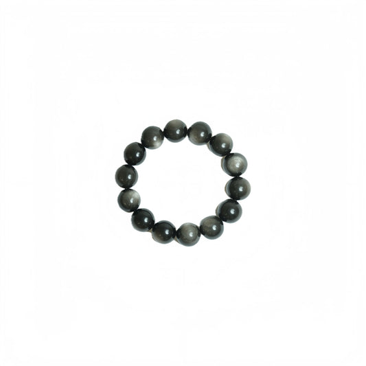 Handcrafted 18mm Silver Sheen Obsidian crystal bracelet with mesmerizing natural chatoyancy, viewed top-down on a clean white background for grounding and reflection at Singoau