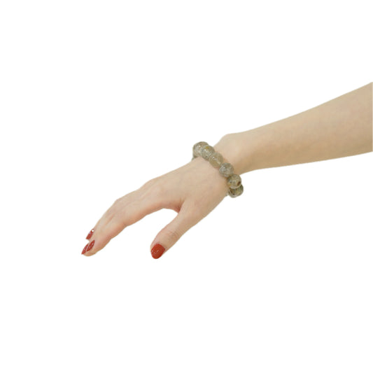 Hand wearing Green Phantom Quartz Bracelet 18mm – Wealth and Growth energy.