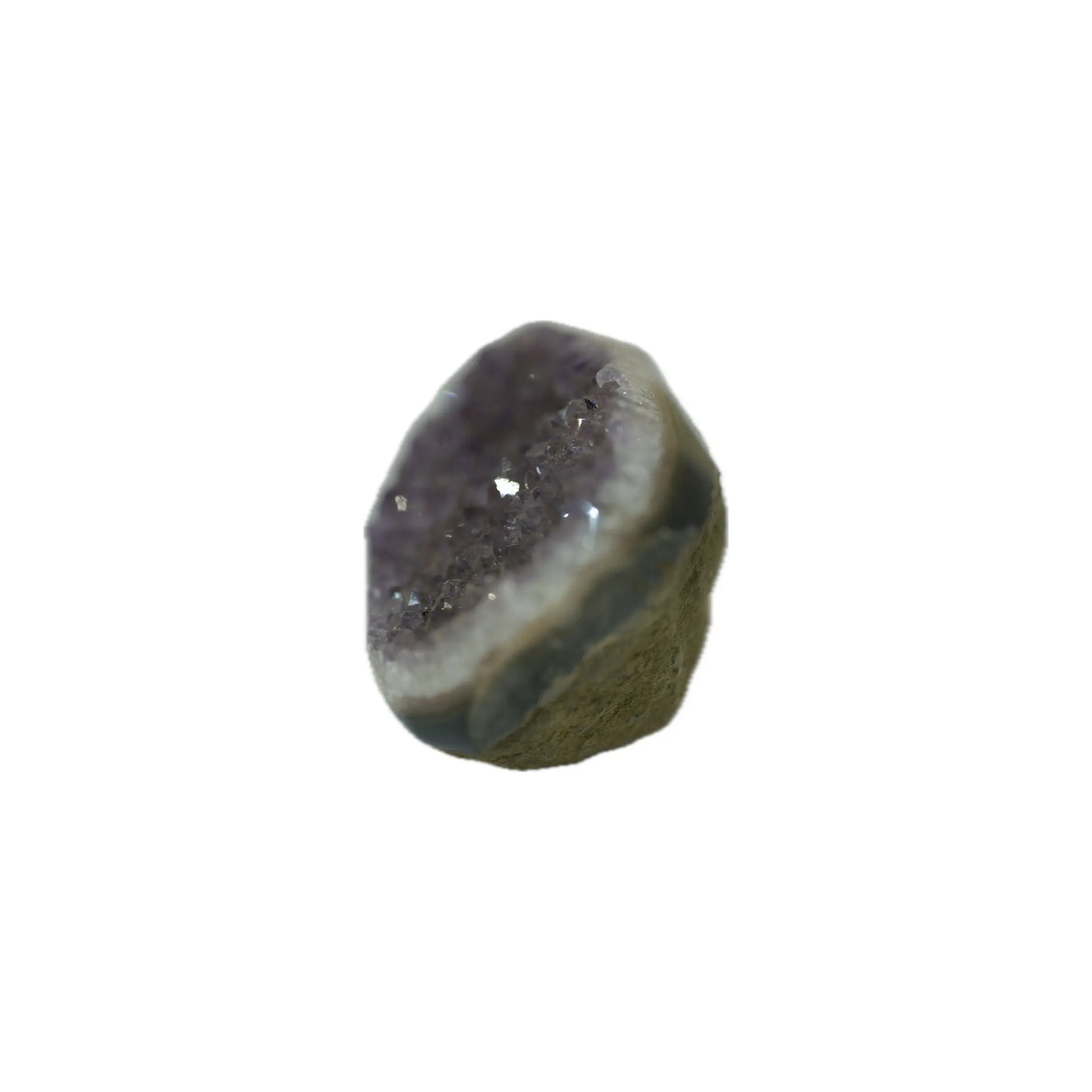 Standing view of a raw purple amethyst stone, showcasing the thickness of the natural rock matrix and the dense druzy crystal face.