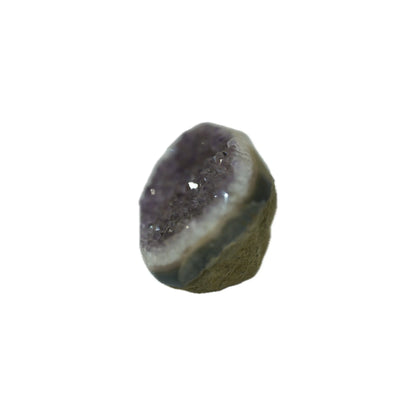 Standing view of a raw purple amethyst stone, showcasing the thickness of the natural rock matrix and the dense druzy crystal face.
