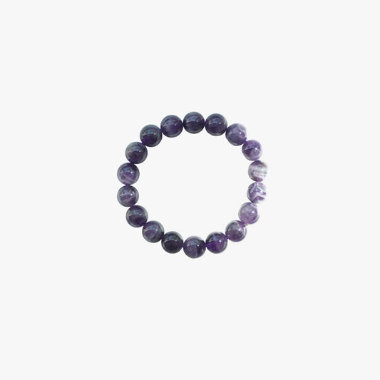 A beaded stretch bracelet made of polished purple gemstone beads with natural white and dark marbling, shown against a plain light gray background.