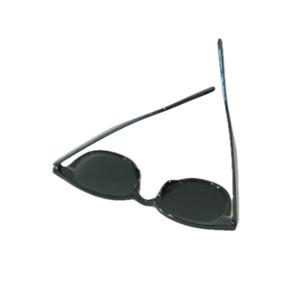 Stylish black sunglasses with oval lenses and sleek frames, resting on a white background.