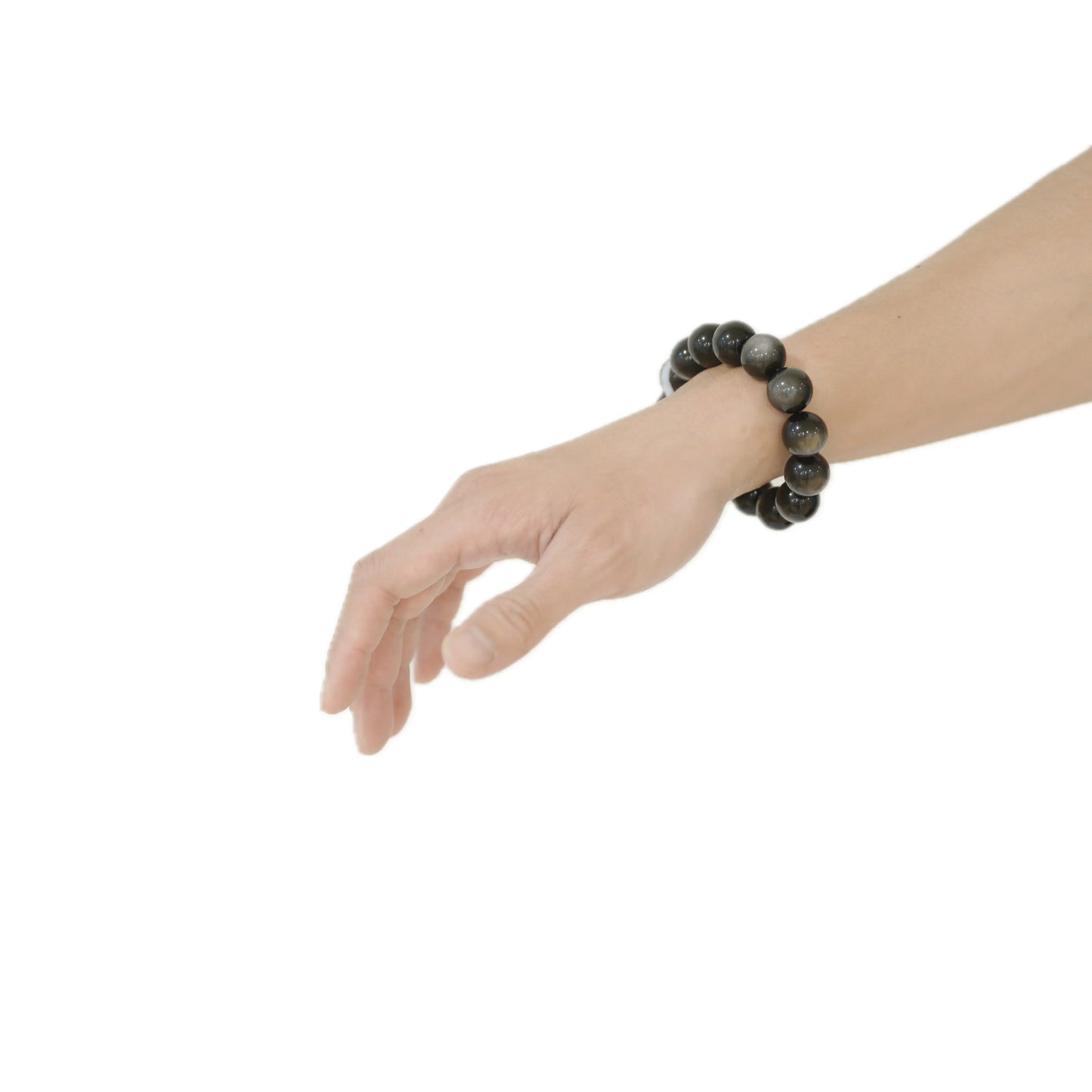 Angled view of the Silver Sheen Obsidian bracelet on a wrist, capturing the captivating natural light play or ‘sheen’ that symbolizes intuition and inner wisdom, handcrafted by Singoau.