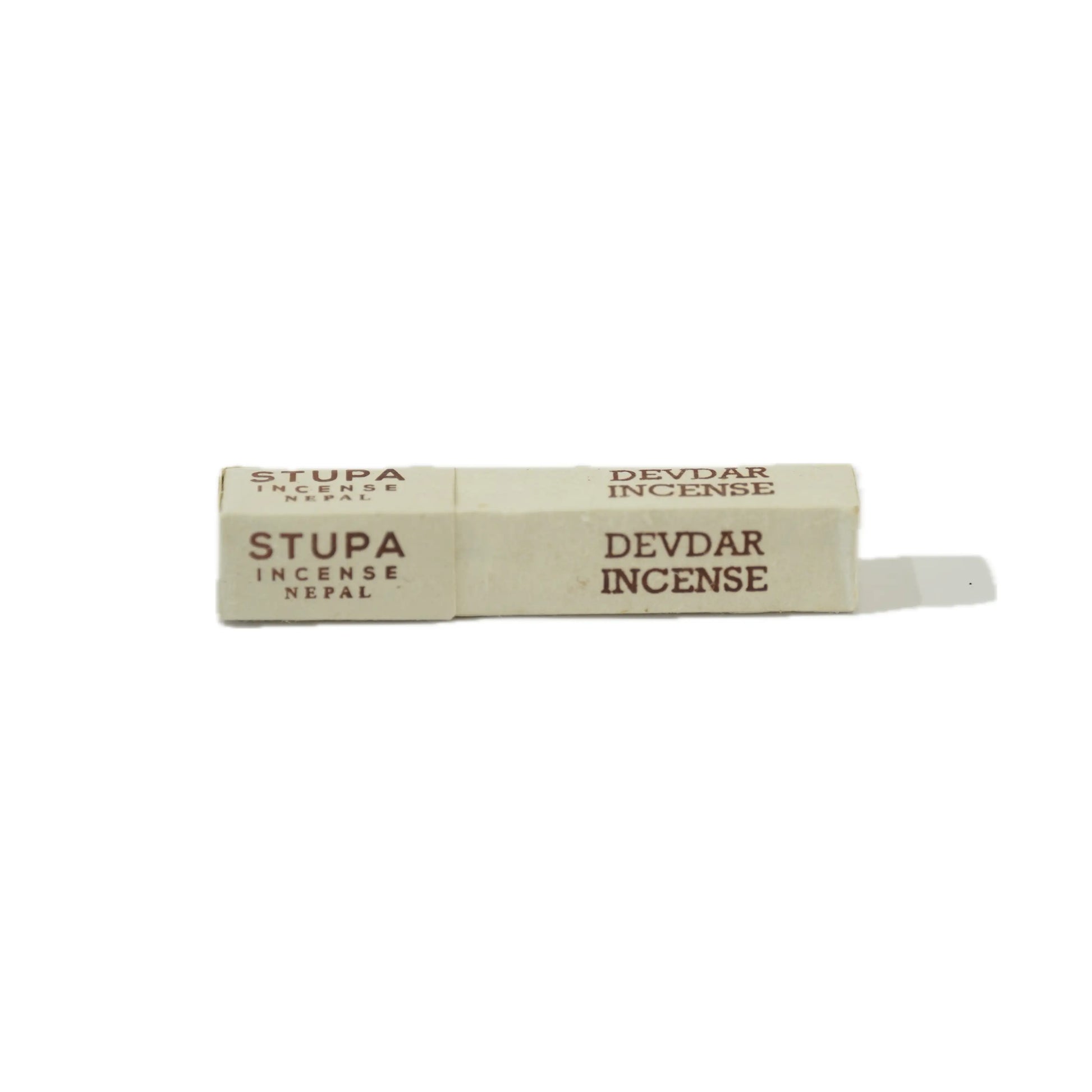 Incense stick with 'Stupa' branding and 'Devdar' scent on a white background