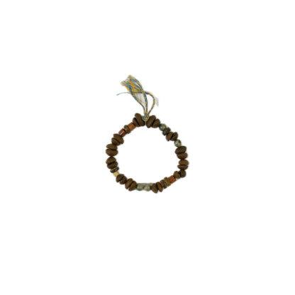 A handcrafted bracelet made of wooden and coffee bean beads, accented with colorful threads on a white background.