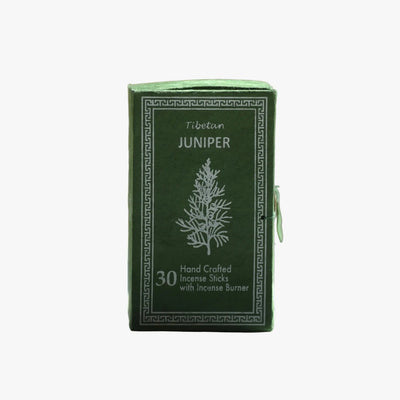 A green rectangular box of Tibetan Juniper incense sticks with white printed text and a tree illustration, shown on a plain light gray background.