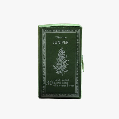 A green rectangular box of Tibetan Juniper incense sticks with white printed text and a tree illustration, shown on a plain light gray background.
