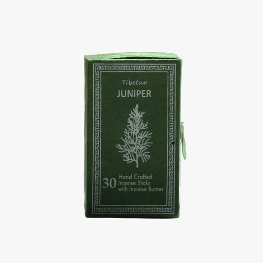 A green rectangular box of Tibetan Juniper incense sticks with white printed text and a tree illustration, shown on a plain light gray background.