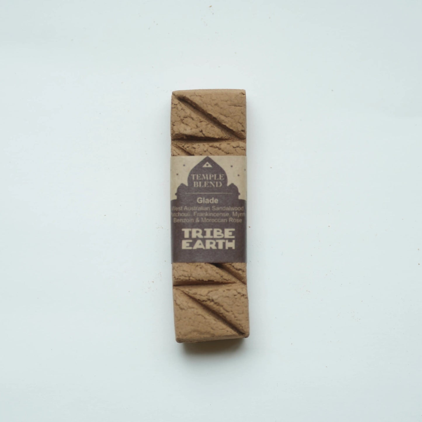 tribe earth incense glade incense standing vertically on a plain white background.