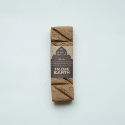 tribe earth incense glade incense standing vertically on a plain white background.