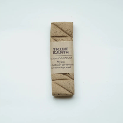 A single Tribe Earth Handmade Incense, labeled 'Mystic', made from Australian Sandalwood, centered on a clean white background.