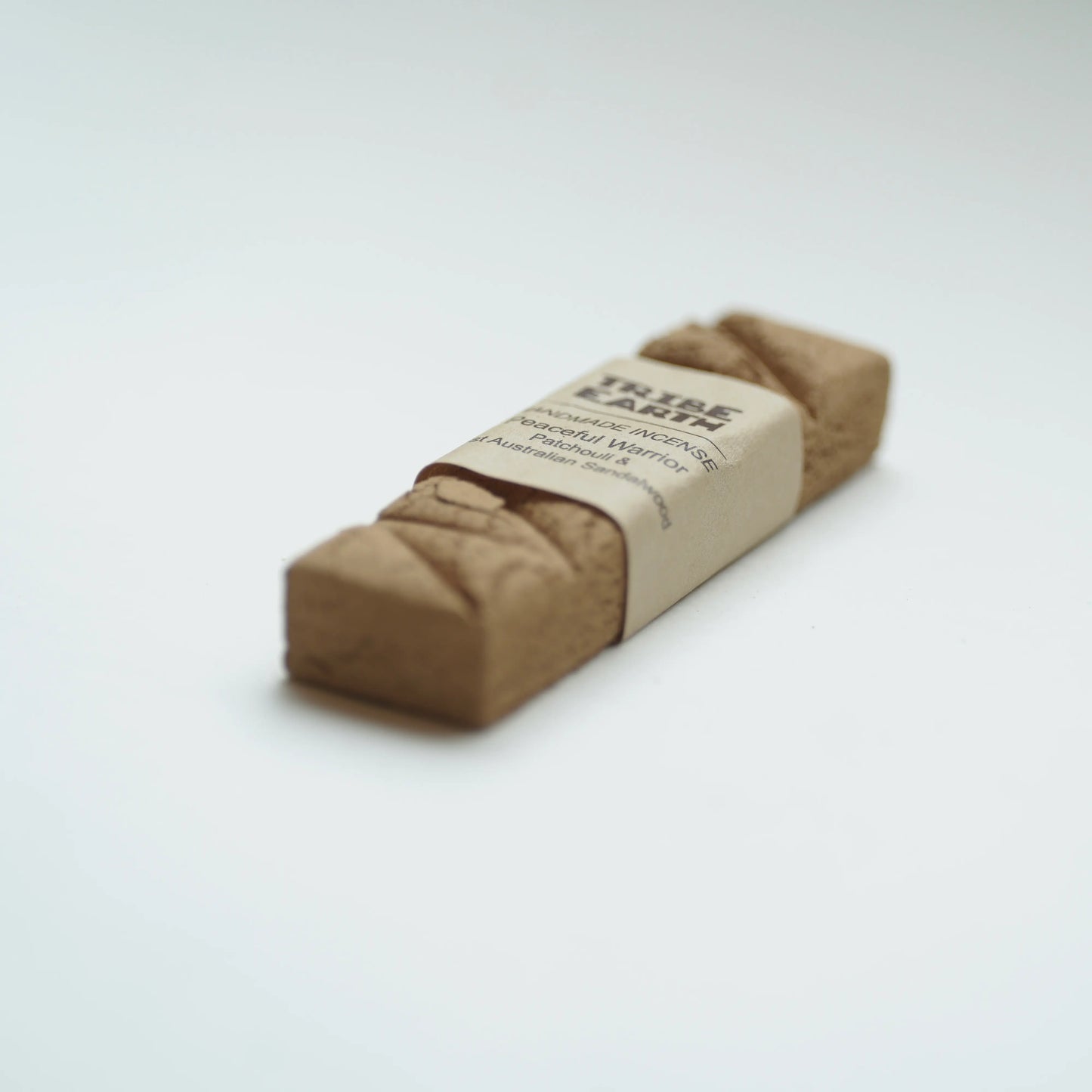 A Tribe earth peaceful warrior incense photographed on a clean white background.