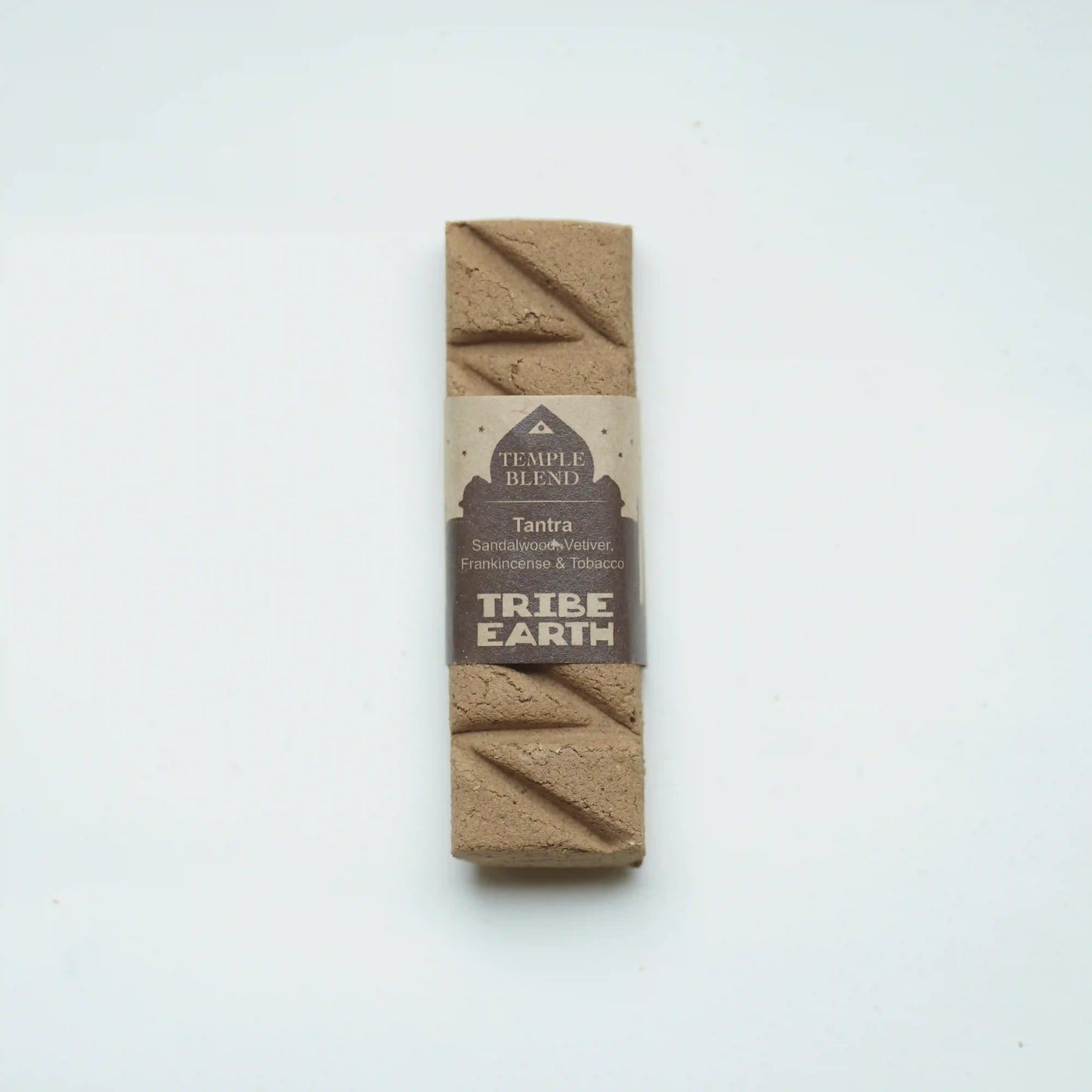 A single rectangular Tribe Earth Temple Blend Tantra coffee bean bar, wrapped in a brown paper label, standing vertically on a plain white background.