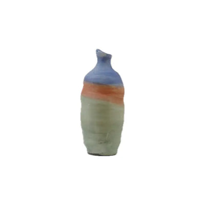A uniquely shaped ceramic vase featuring a blue top, orange stripe, and green body, set against a plain white background.