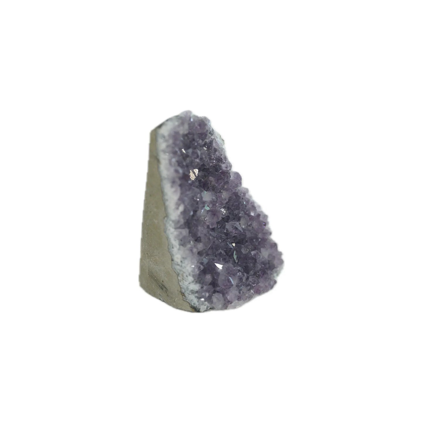 Amethyst crystal geode with purple facets and rough outer stone, standing upright against a white background.