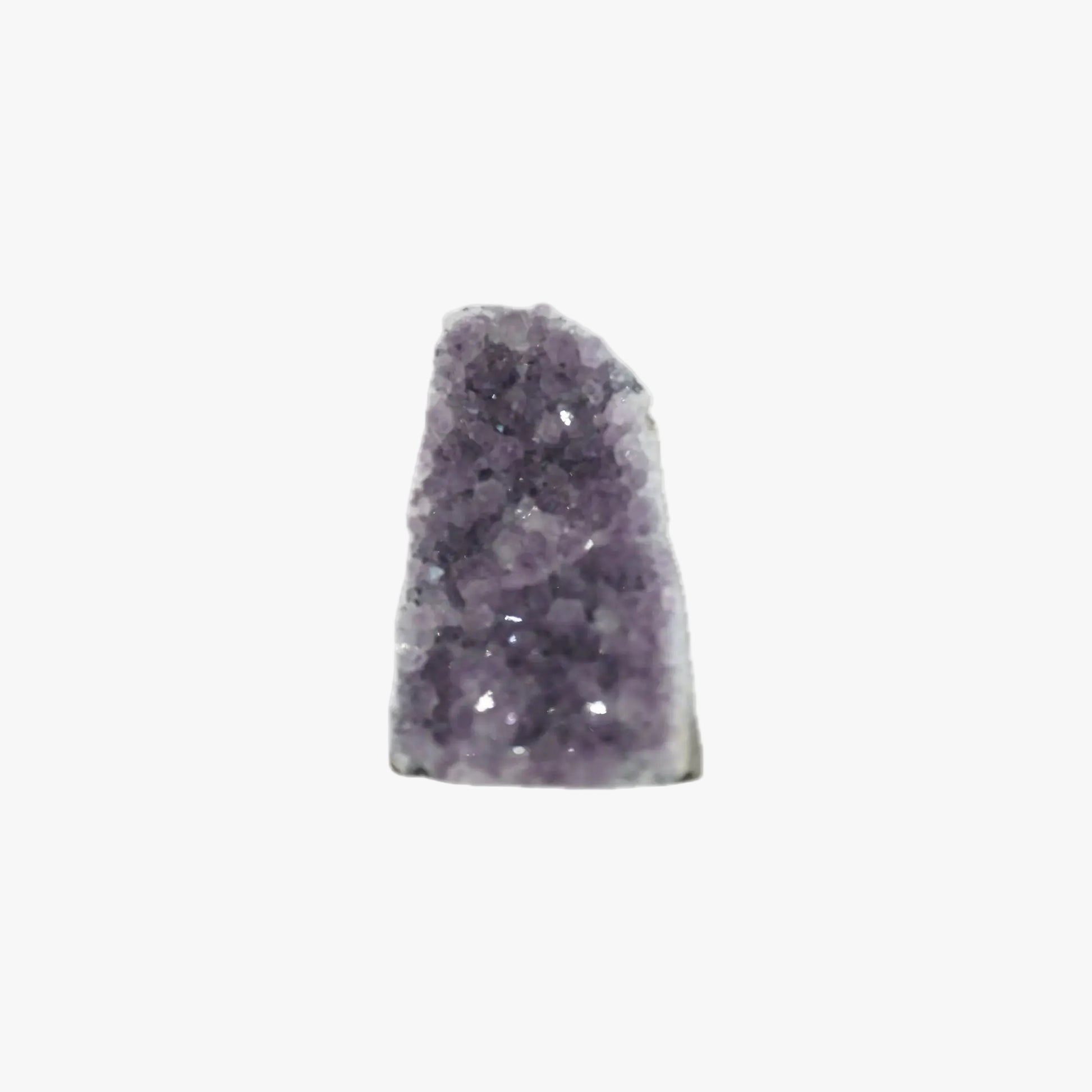 Small, triangular amethyst crystal cluster with purple quartz crystals on a white background.