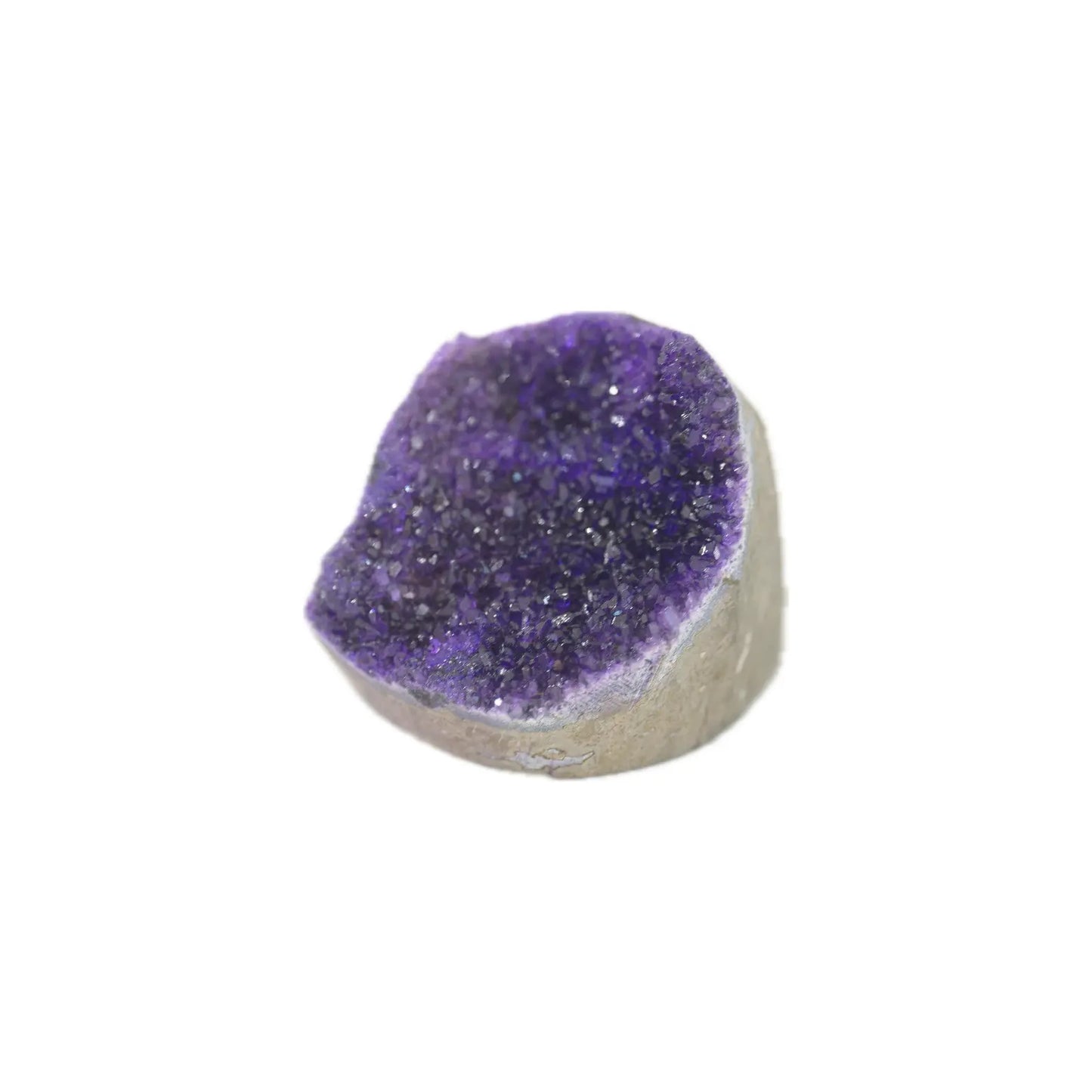 A natural amethyst geode dome with a deep purple crystal interior and a light gray stone base, shown on a plain white background.