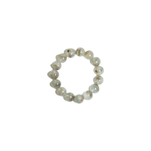 Handpicked 18mm Green Phantom Quartz crystal bracelet viewed top-down against a white background, displaying scenic natural inclusions and high clarity for heart chakra restoration at Singoau.