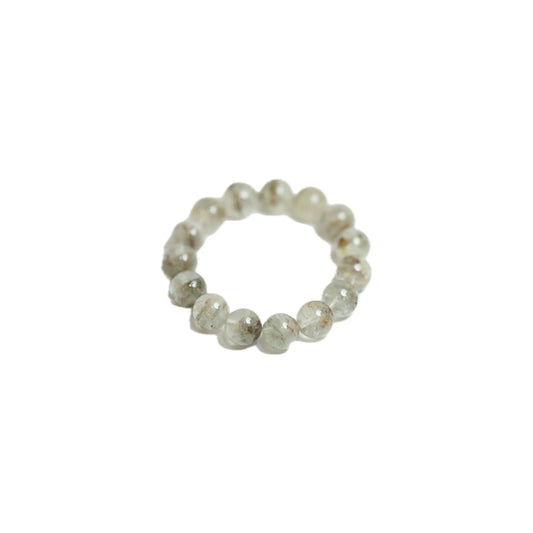 Angled product shot of the substantial 18mm Green Phantom Quartz gemstone bracelet, showcasing the volumetric dreamlike landscapes captured within each natural bead, curated for abundance and mindful luxury by Singoau