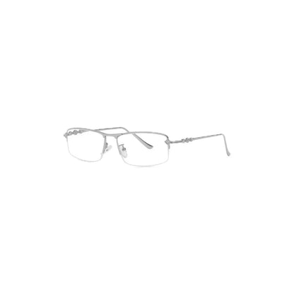Sleek, silver-framed eyeglasses with clear lenses, showcasing a minimalist design and decorative details on the temples.