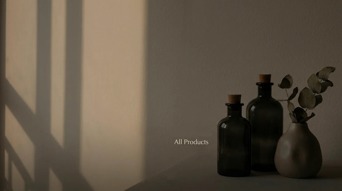 Three dark glass bottles with cork lids on a surface, with 'All Products' text overlay.
