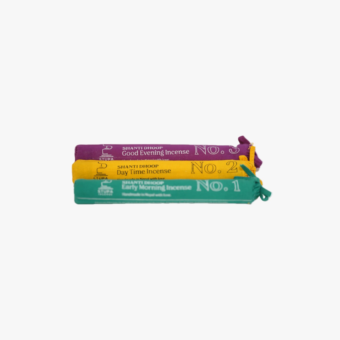 A centralized view of the three STUPA Trilogy of Light incense tubes (Morning, Day, Evening) stacked against a plain white background, illustrating the complete daily ritual curation available at Singoau.